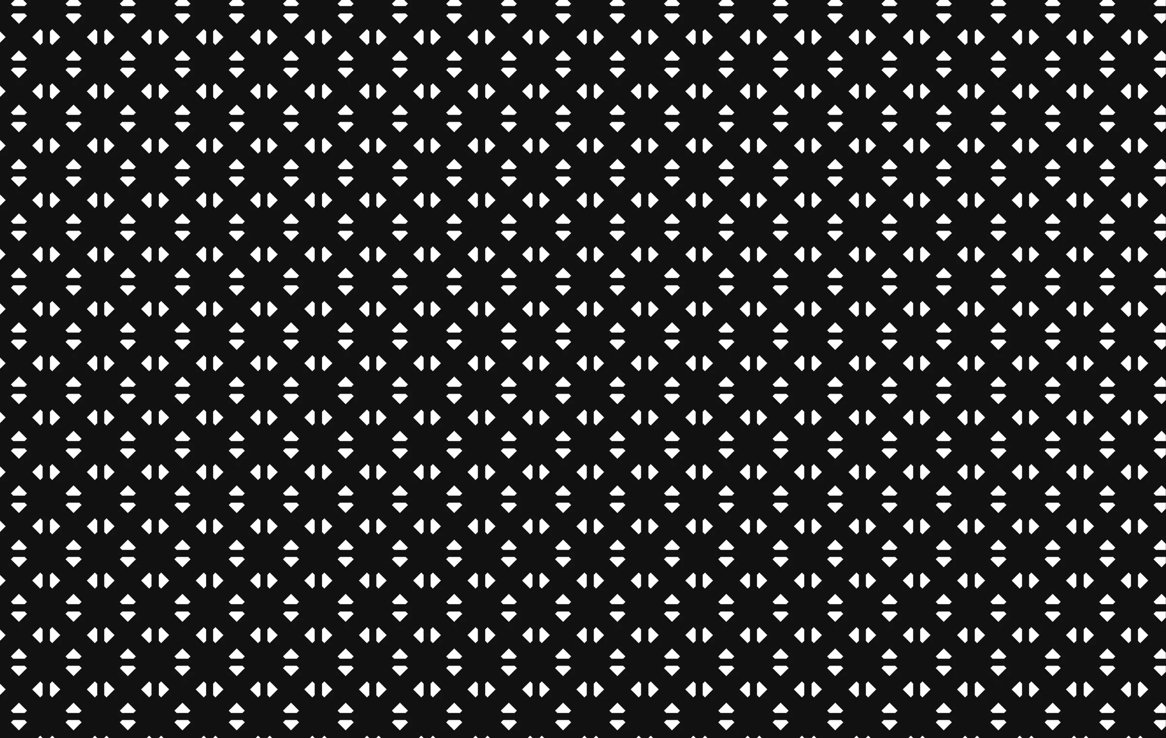 The brand pattern: the emblem repeated on black with triangular facets between