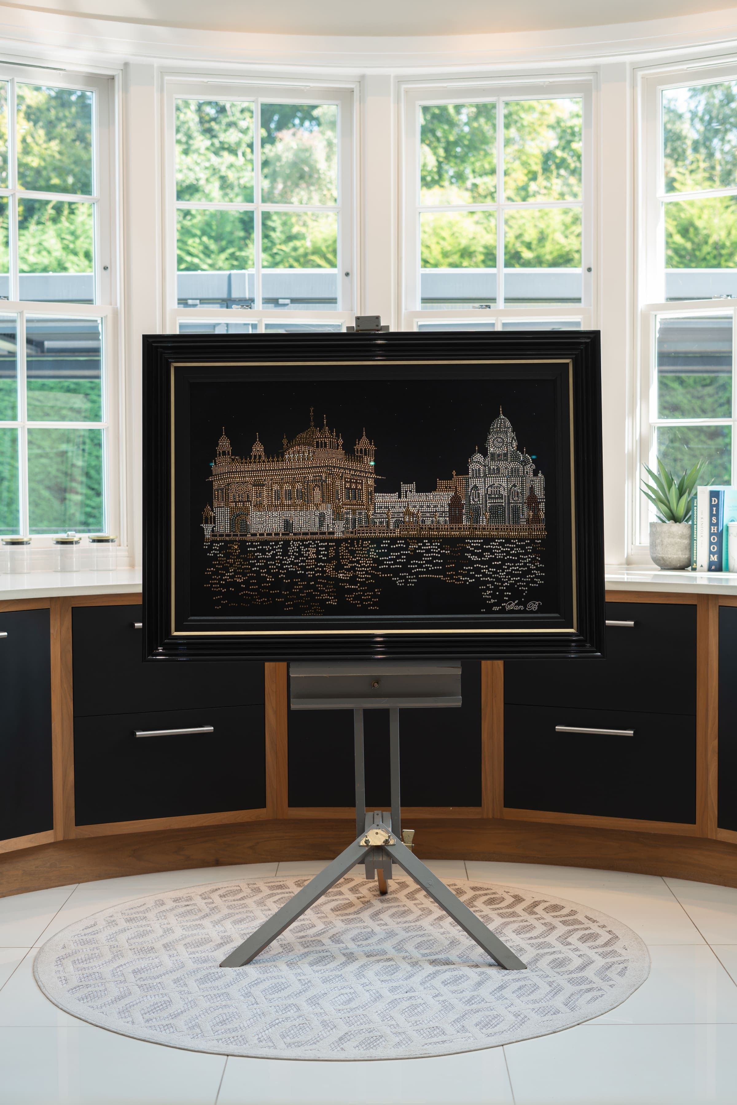 The Golden Temple in crystal on an easel in a bay window
