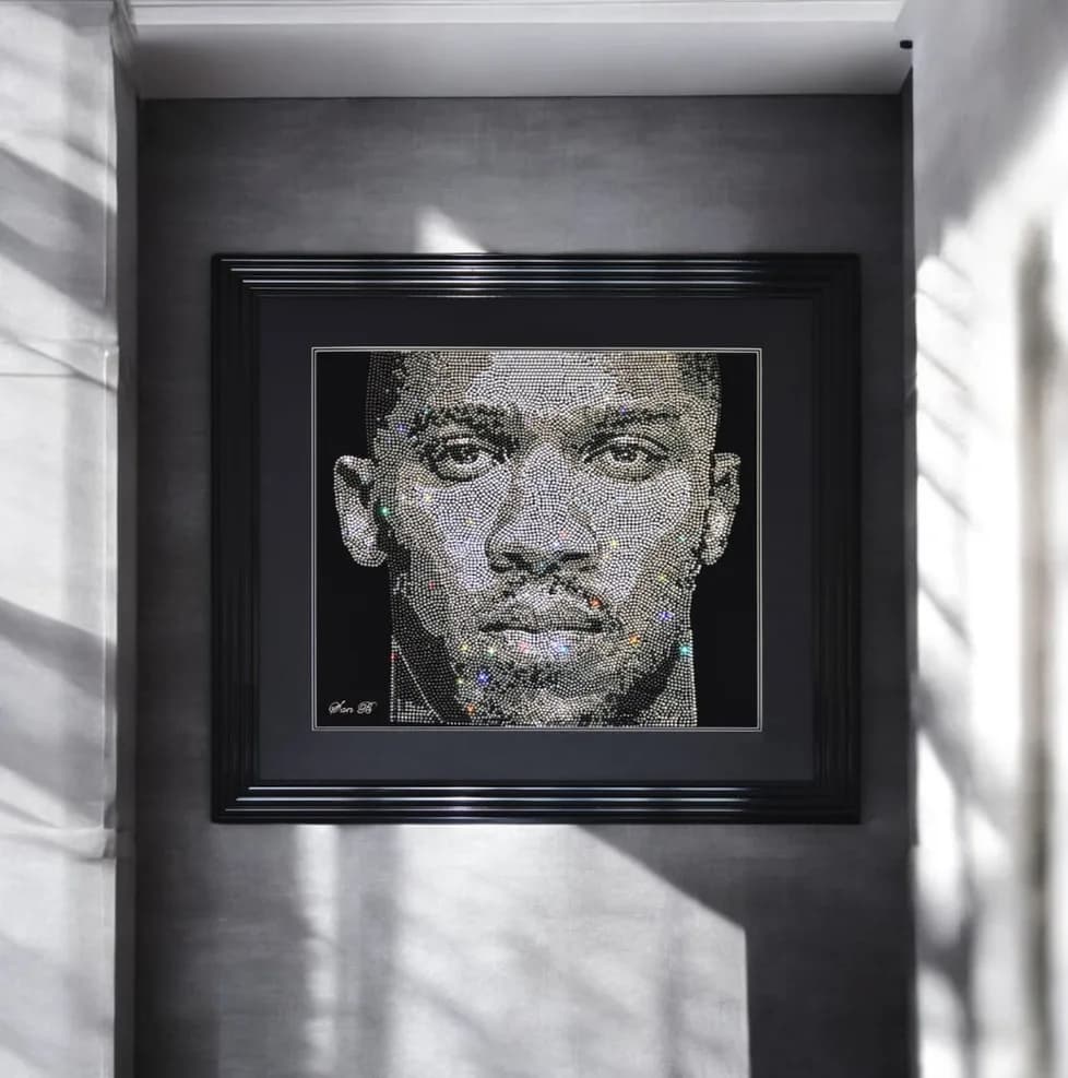 Anthony Joshua in crystal, framed on a grey wall in sunlight