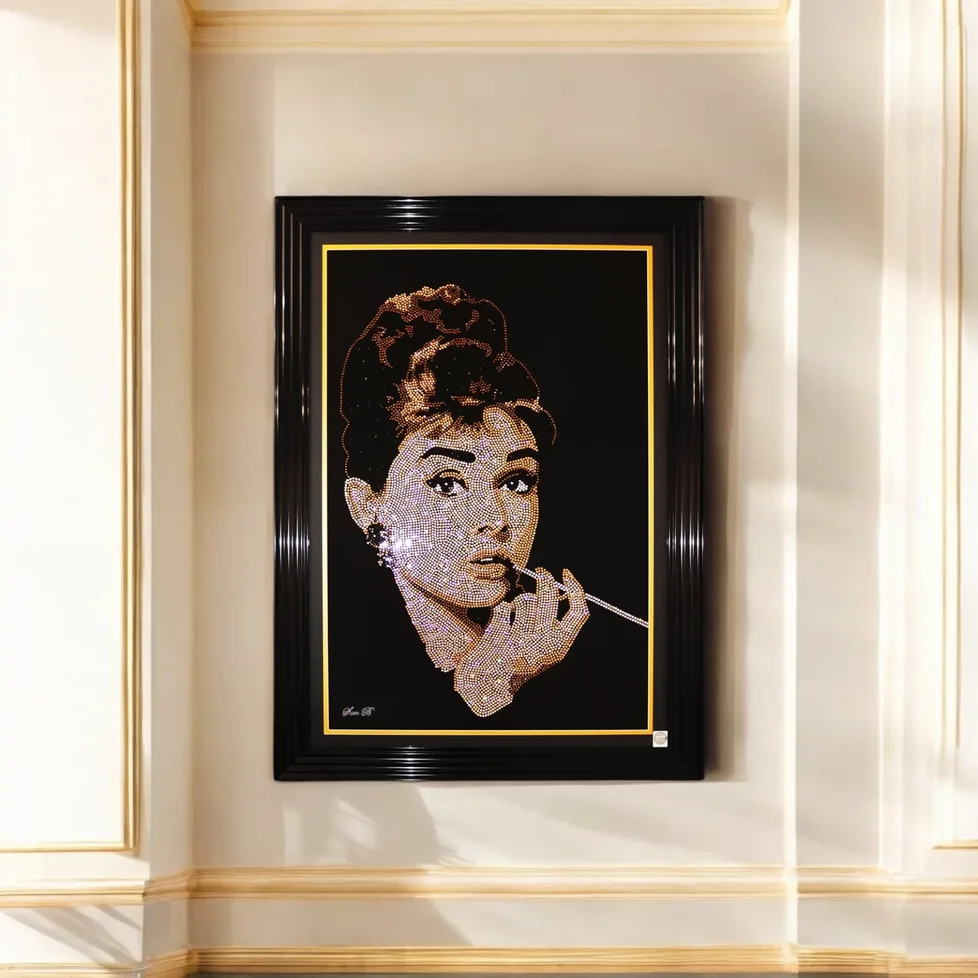 Audrey Hepburn in crystal, framed on a cream panelled wall