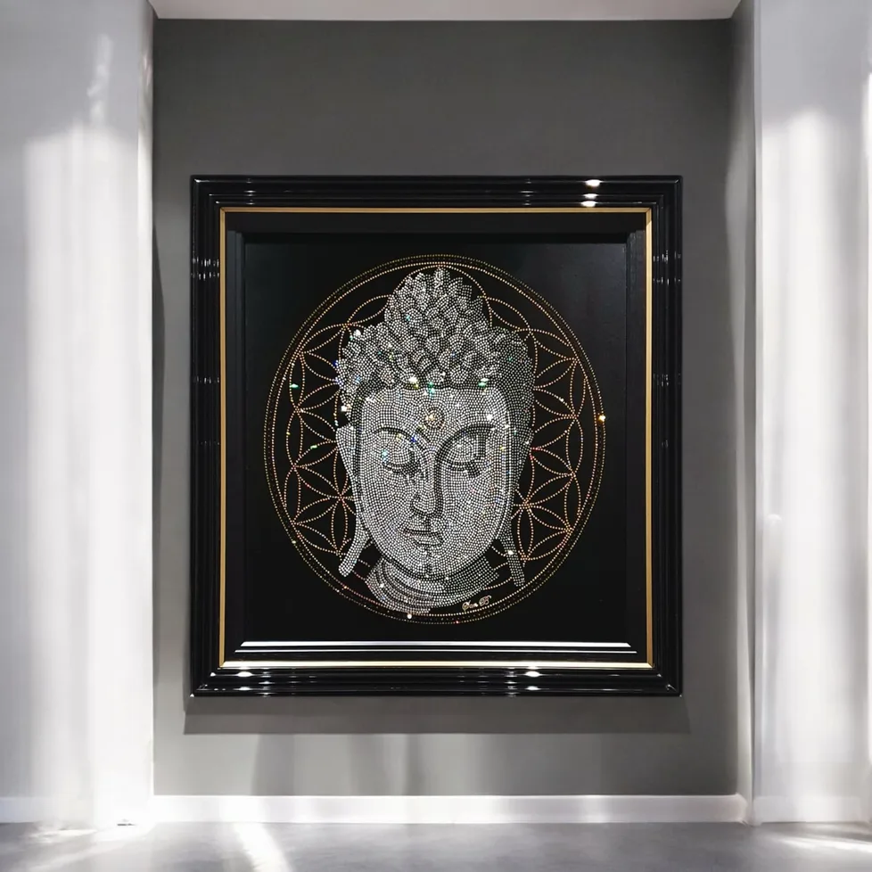 The Buddha in crystal, framed on a white wall