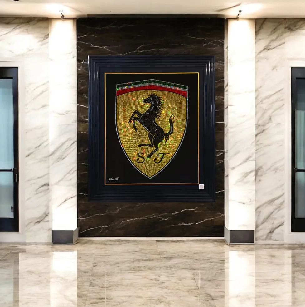 The Ferrari badge in crystal, framed in a marble hall