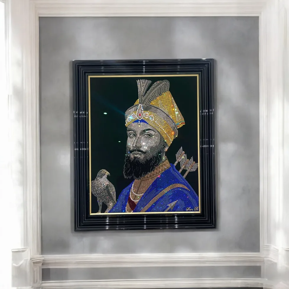 Guru Gobind Singh in crystal, framed on a grey wall