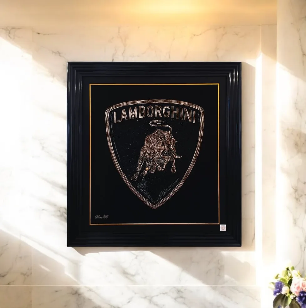 The Lamborghini badge in crystal, framed on a marble wall