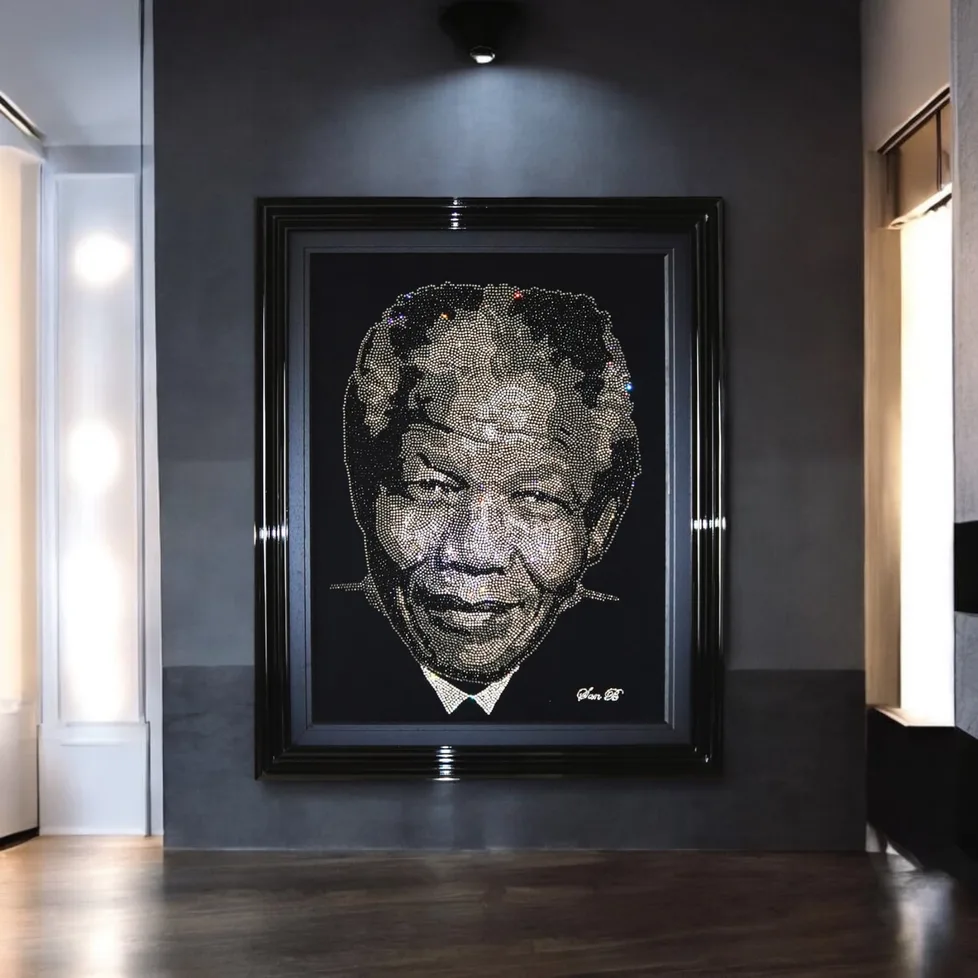 Nelson Mandela in crystal, framed on a dark wall