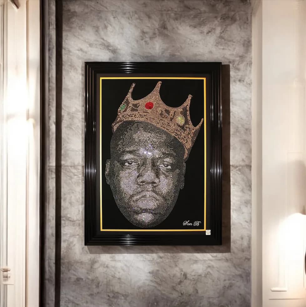 The Notorious B.I.G. in crystal, crowned, framed on a marble wall