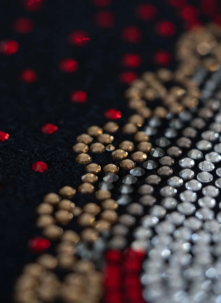 Red and gold crystals against clear, close