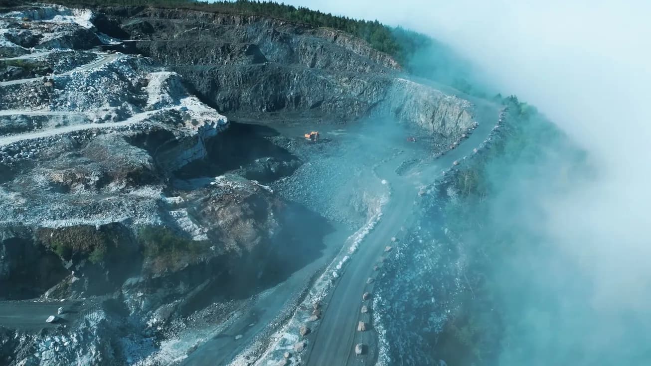 The quarry road in mist, from the air