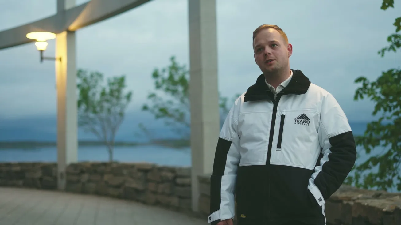 An interview on the terrace in a Teako jacket, the fjord behind