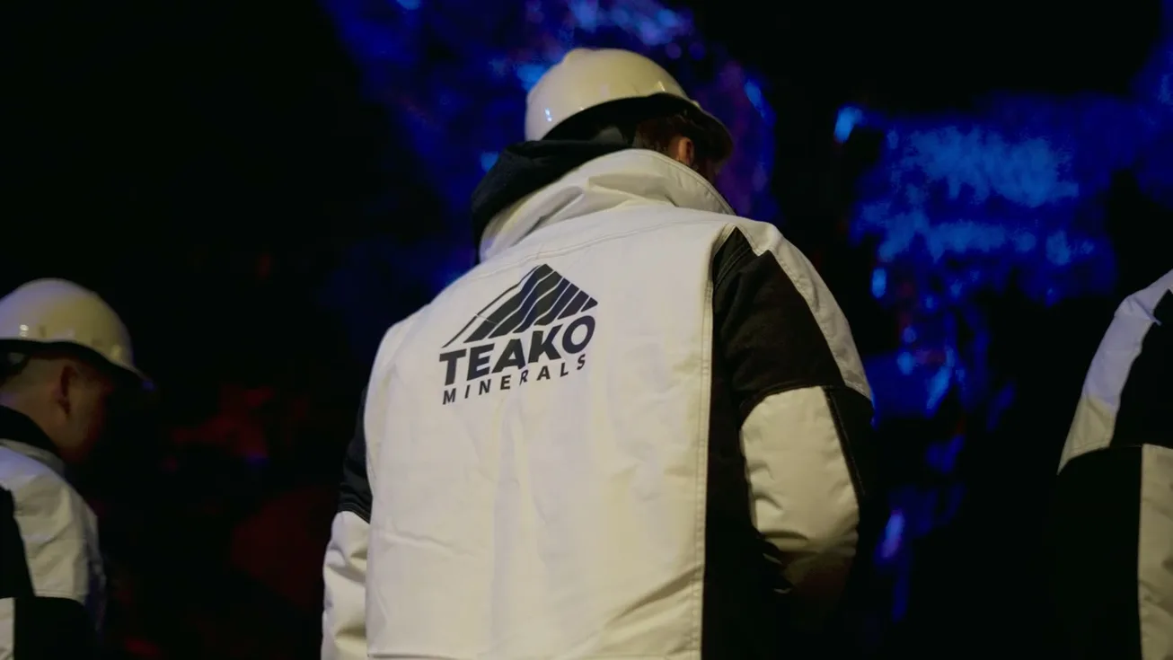 A Teako jacket among the crew underground, the rock lit blue