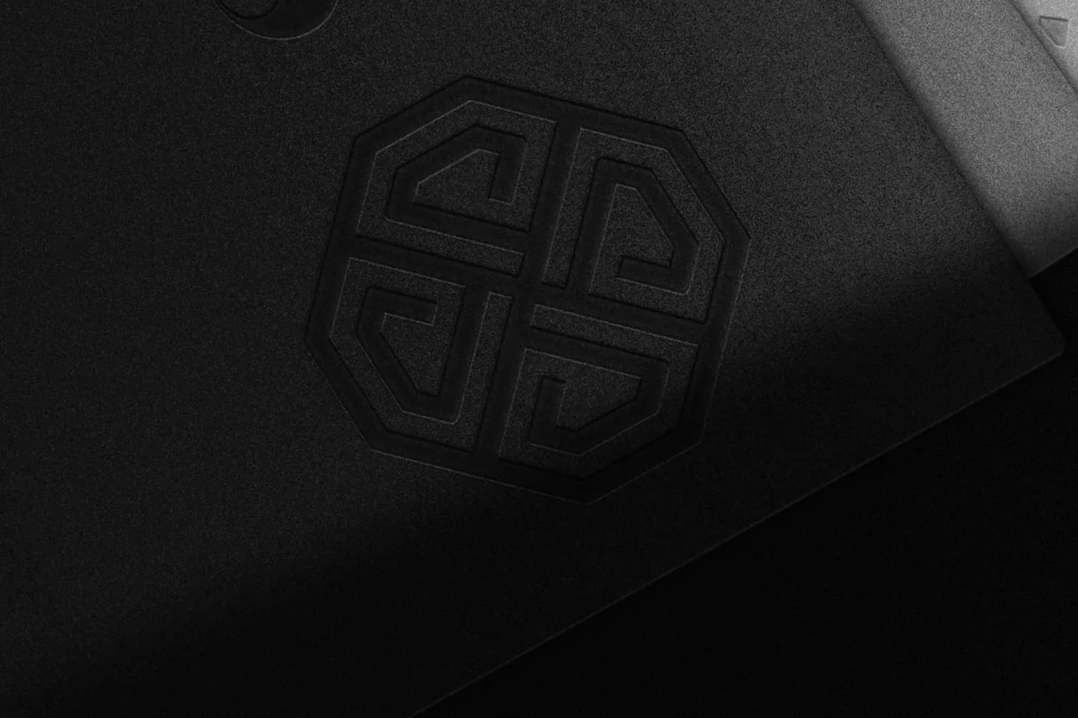 The San B emblem and wordmark blind-embossed on a black folder