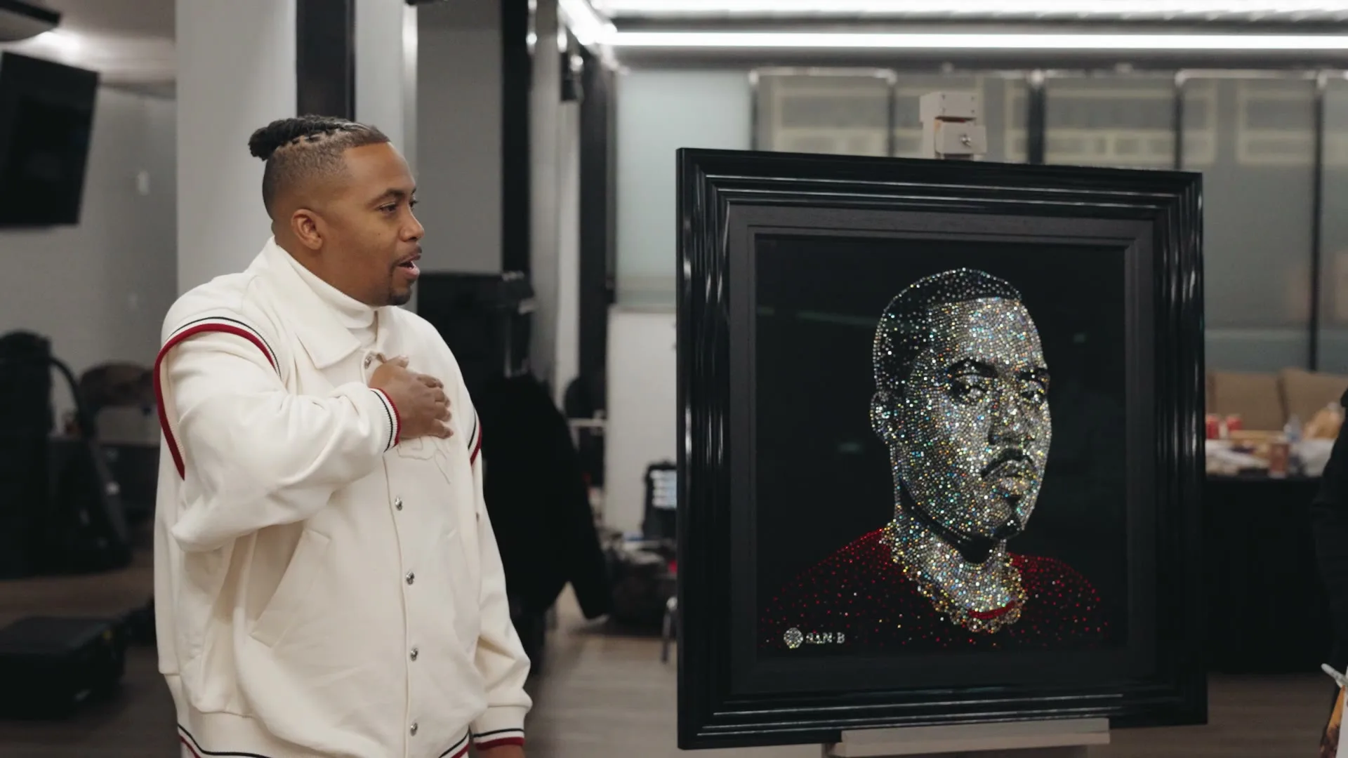 Nas beside his finished crystal portrait, from the Nas film